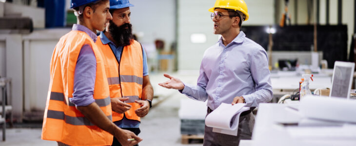 Employees in factory working together