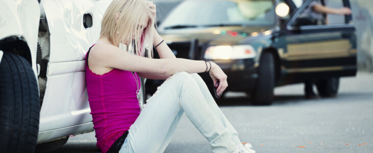 A police officer at a car accident scene.