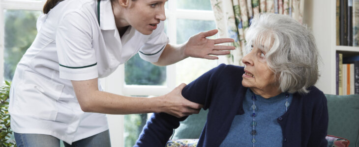 Care Worker Mistreating Senior Woman At Home