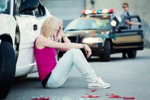 Augusta car accident lawyer for a crash scene where a police officer is writing the report