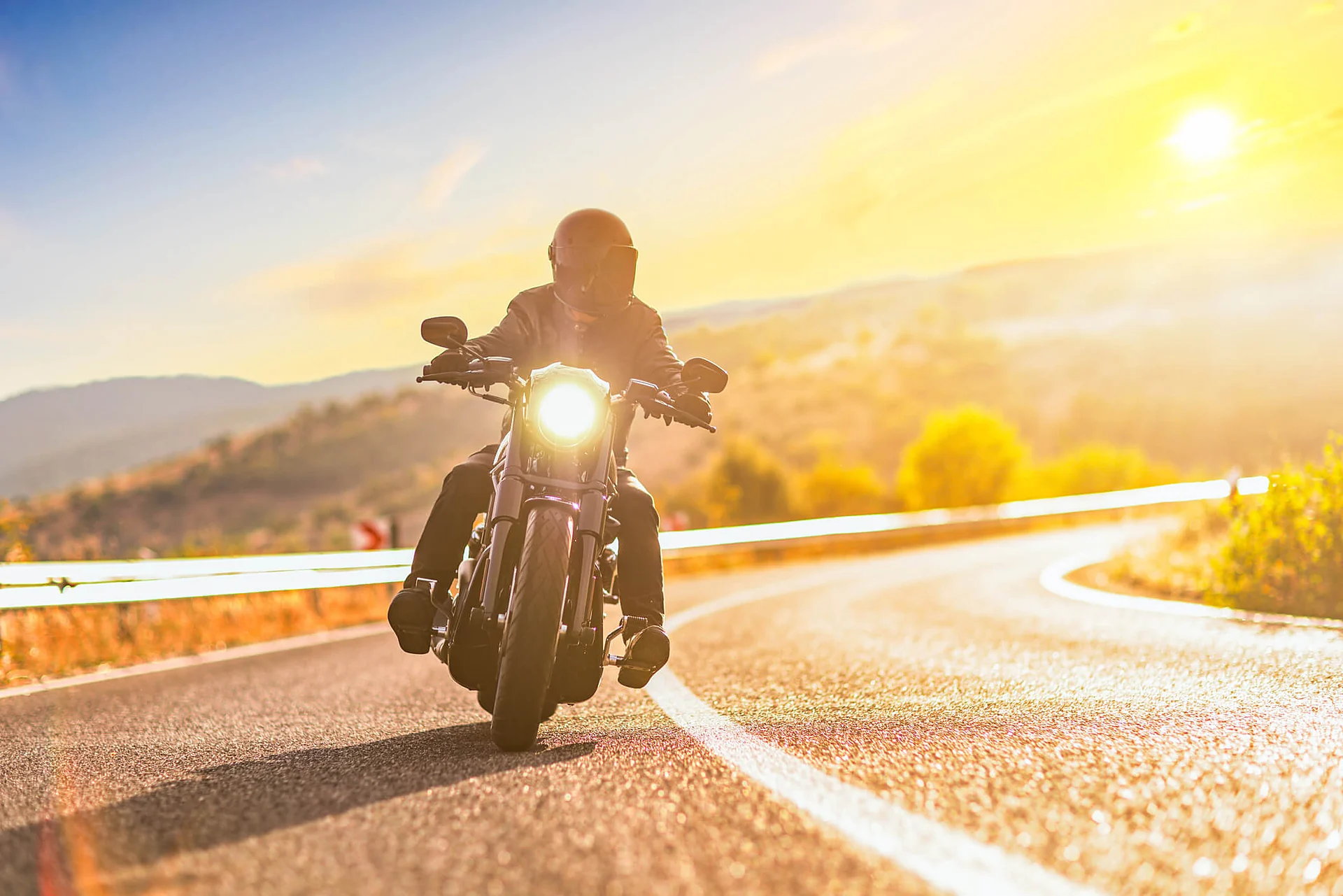 Macon motorcycle accident lawyer for riders injured on an open highway at sunset