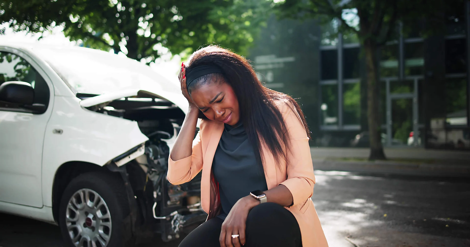 Warner Robins car accident lawyer for an upset driver standing in front of a car collision